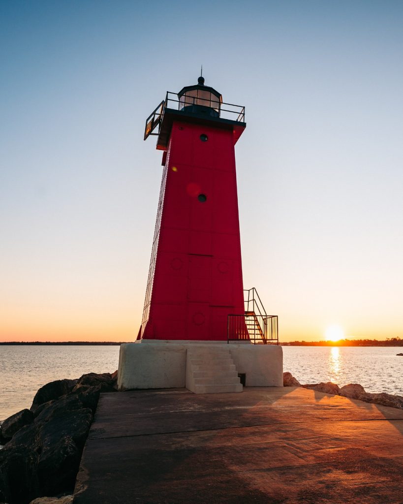 The Manistique Boardwalk leading to the iconic red East Breakwater Light. Credit: @puremichigan via Instagram