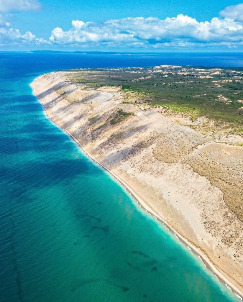 A breathtaking aerial view of the Sleeping Bear Dunes National Lake Shore. Credit: @greatlifegreatlakes via Instagram